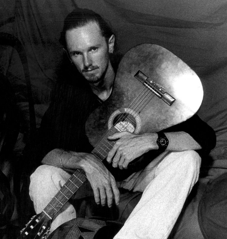 a much younger me posing with my Epihone Gibson acoustic guitar © Don's Art