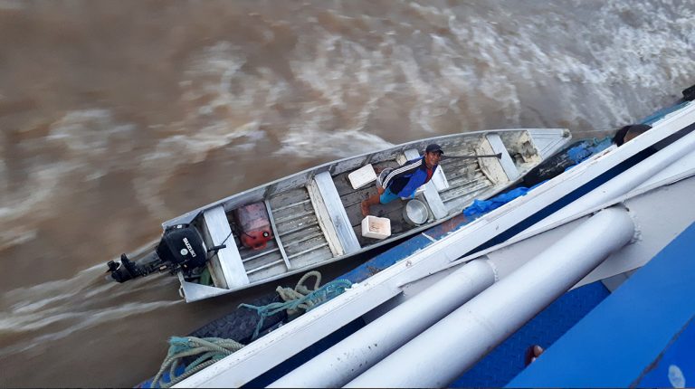 Boats of Brazil, Amazon River boat cruise, food vendor. Copyright © Don's Art