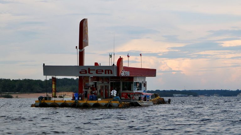 Boats of Brazil, Amazon River, fueling station. Copyright © Don's Art