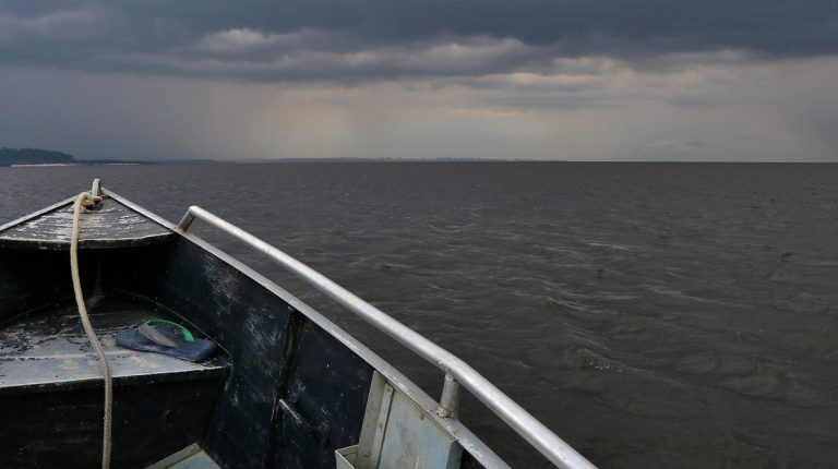 Boats of Brazil, Amazon River, stormy waters. Copyright © Don's Art